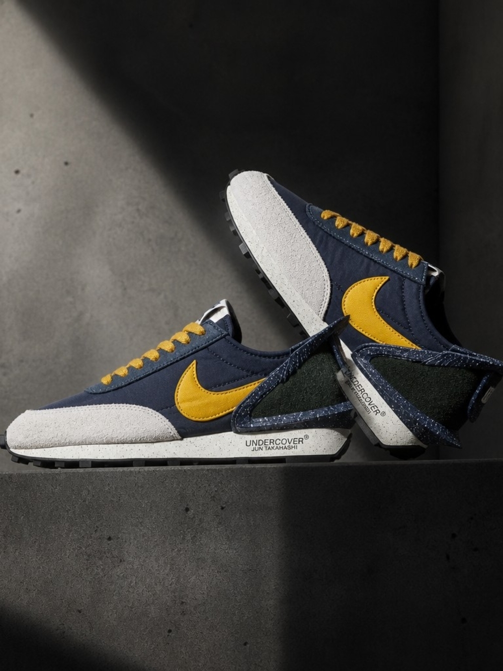 Nike navy and yellow retro runner sneakers